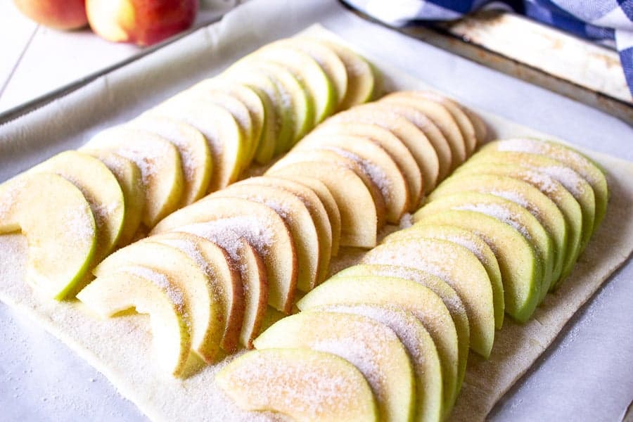 Apple slices covered with cinnamon and sugar.