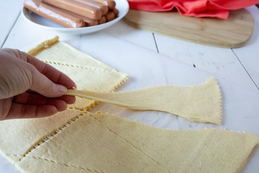 Crescent dough being stretched out.