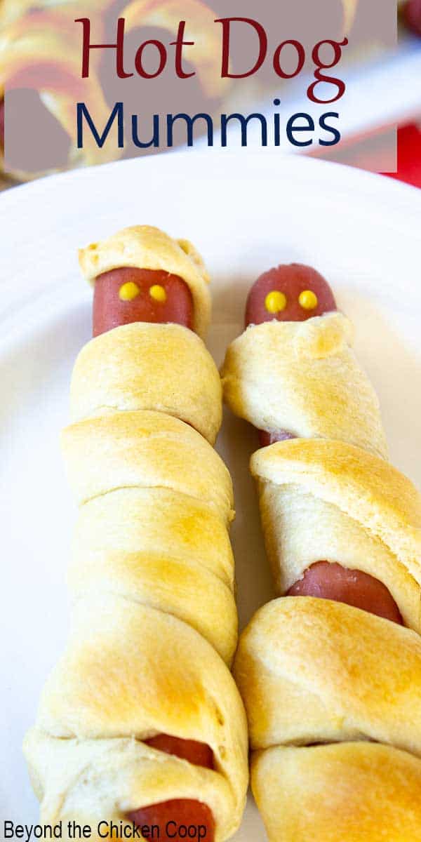 Two hot dogs wrapped in bread. 