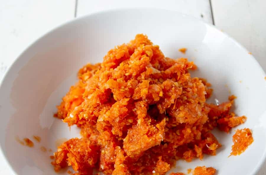 Tomato pulp in a white bowl.