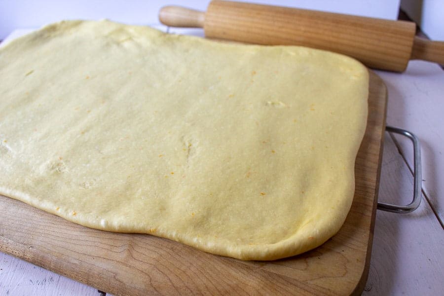 Sweet bread dough rolled out into a rectangular shape. 