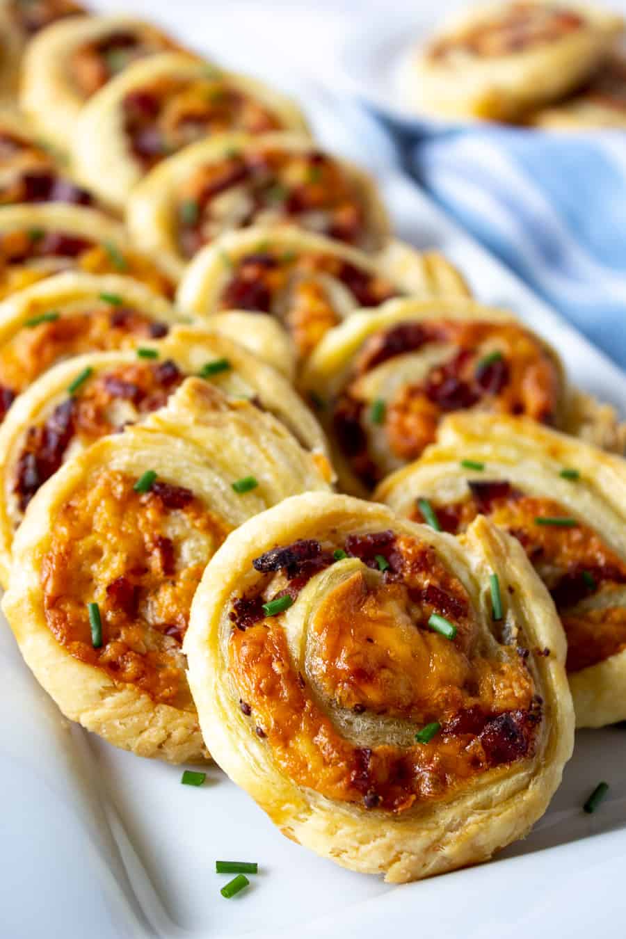 A platter filled with puff pastry pinwheels.