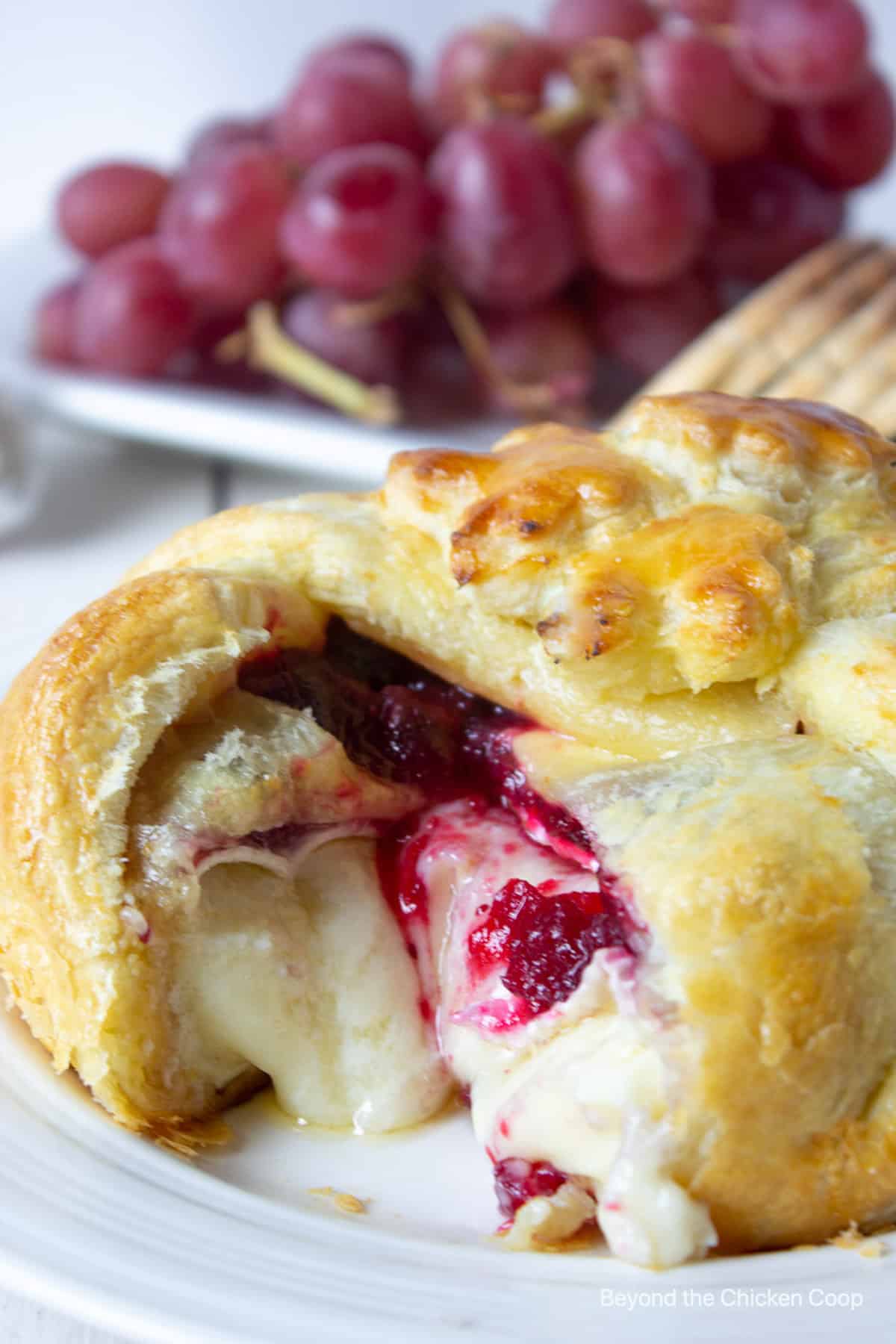 Puff pastry shell with brie and cranberries.