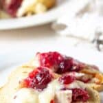 Melba toast topped with brie and cranberries.