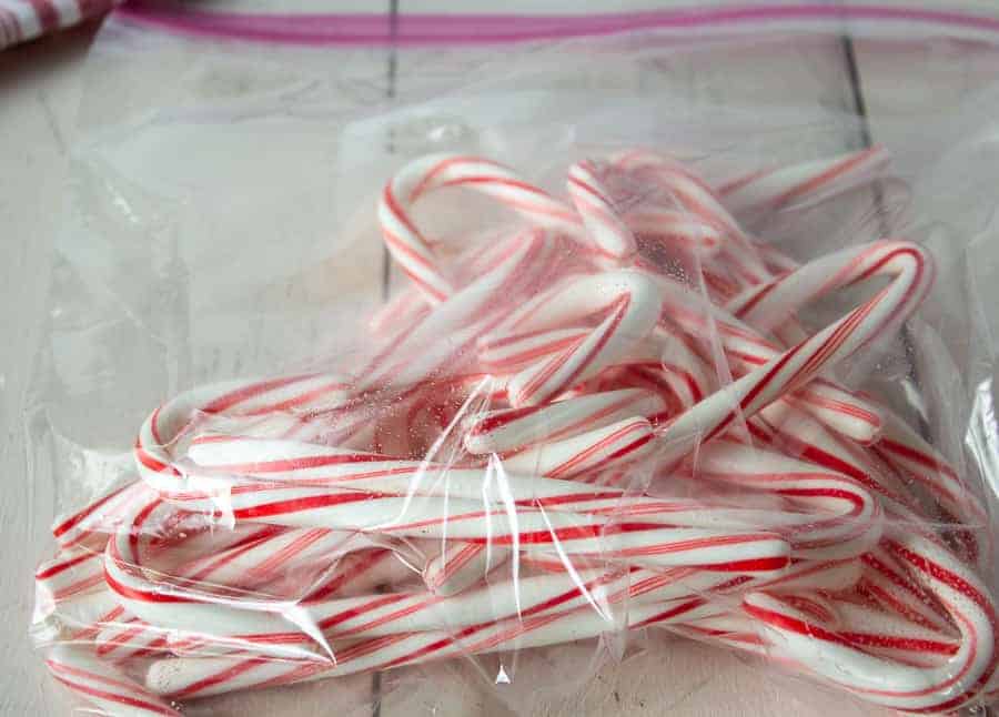 A plastic bag filled with candy canes.