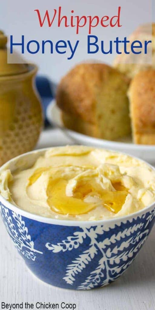 A small blue and white bowl filled with butter and honey.
