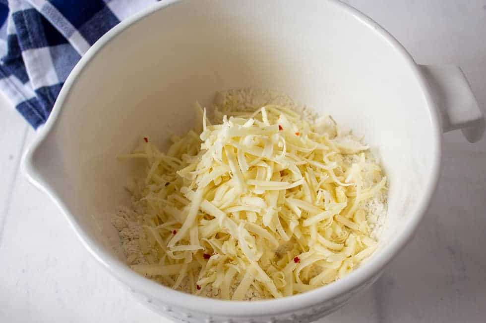 Shredded cheese in a large bowl.