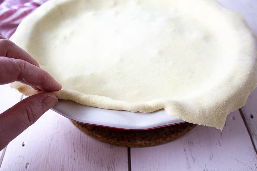 Folding puff pastry under.