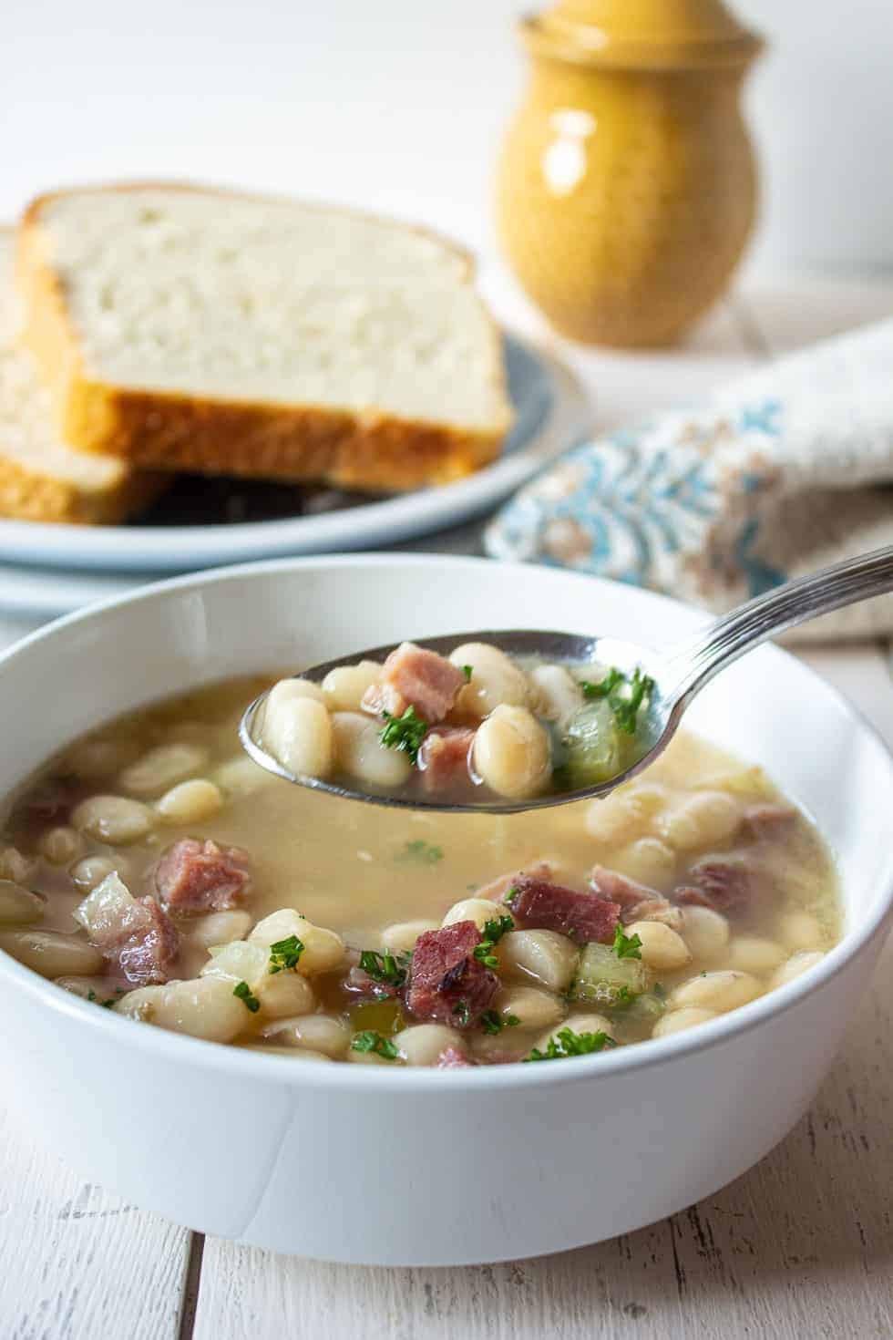 A spoonful of ham and bean soup. 