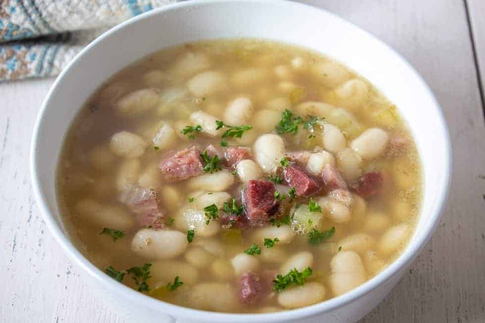 White beans and ham in a broth. 