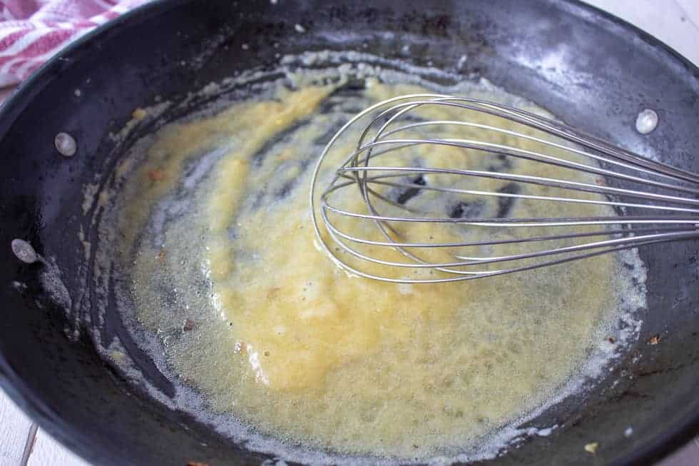 Butter and flour mixed together in a pan.