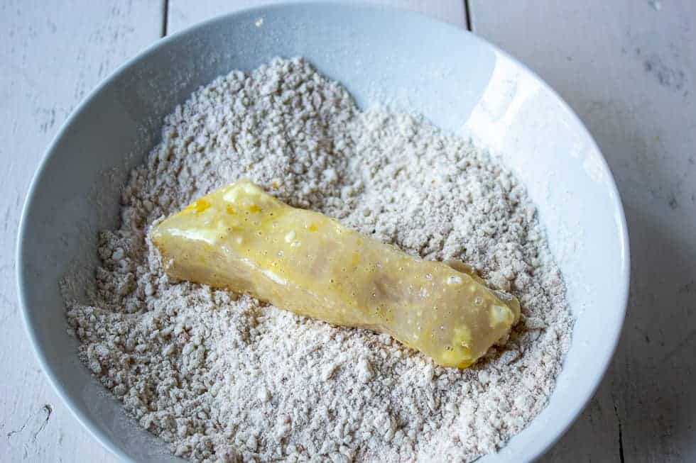 Chicken breast in a panko and flour mixture.