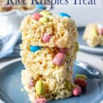 A stack of rice krispies treat on a blue plate.