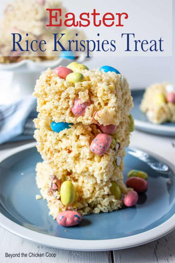A stack of rice krispies treat on a blue plate.