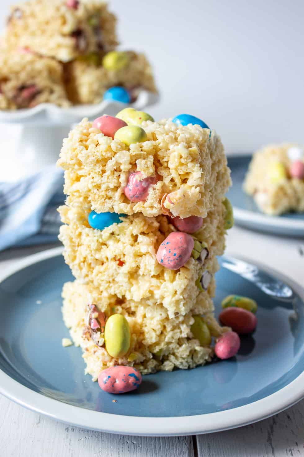 A stack of Rice Krispies treats with malted Easter eggs. 