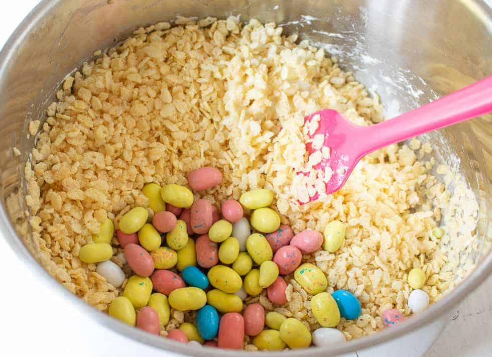 Mini melted malted colored eggs in a pot with rice Krispies.