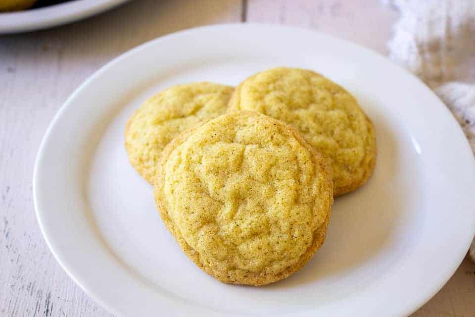 Three cookies arranged on a small white plate.