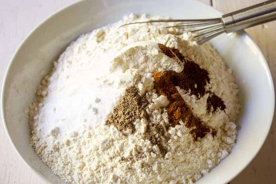 A small bowl filled with flour and spices.