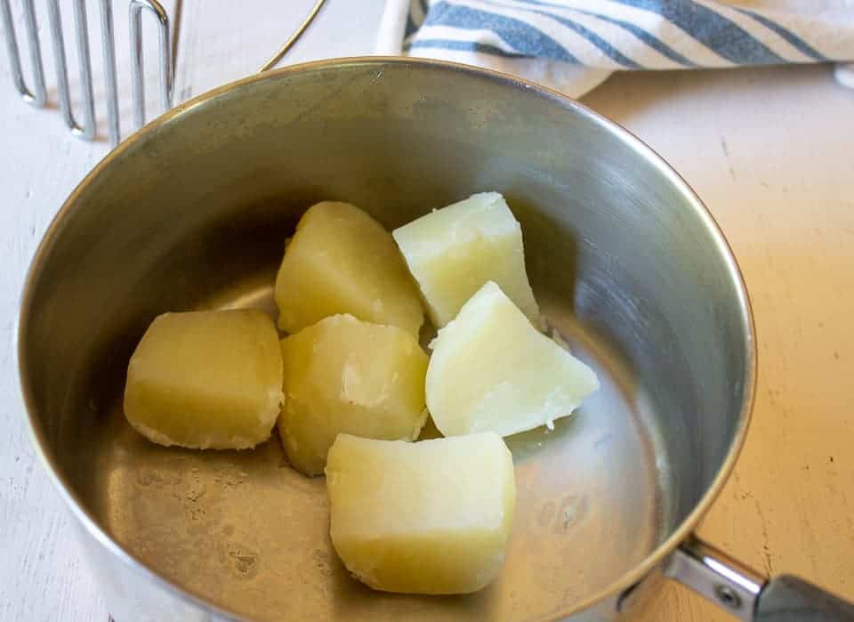 Cubed potatoes in a pot.