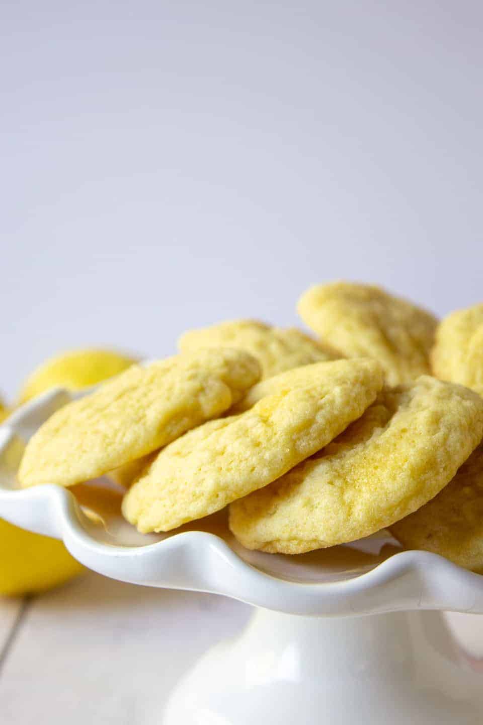 Cookies arranged on a white cake stand. 