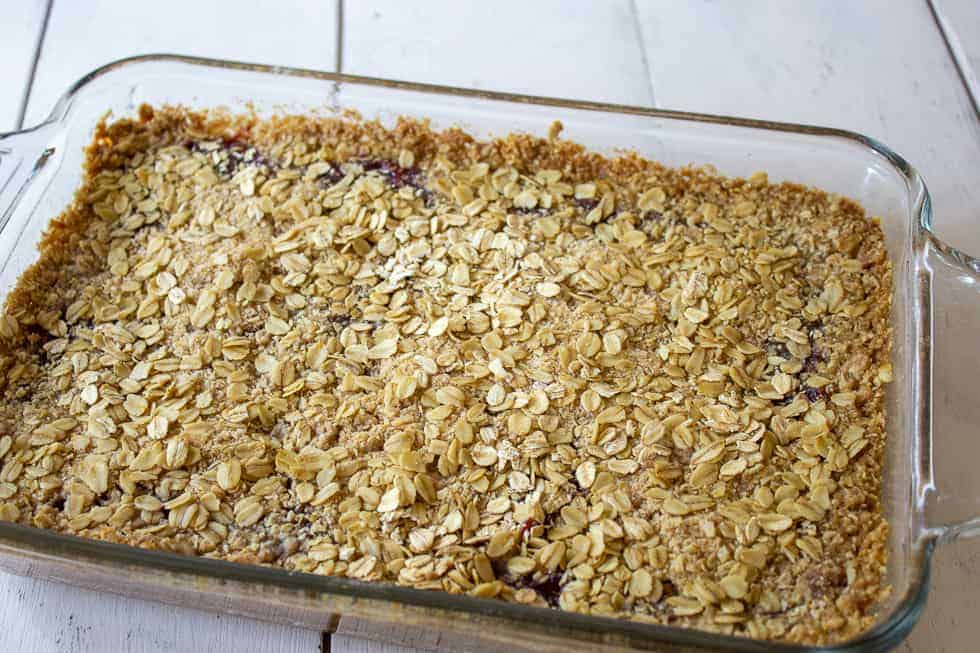 Baked raspberry bars in a glass casserole dish.