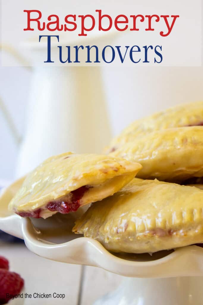 Small hand pies on a white cake stand.