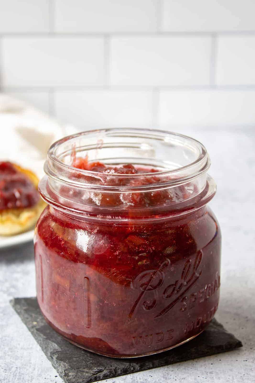 Rhubarb jam in a glass canning jar. 