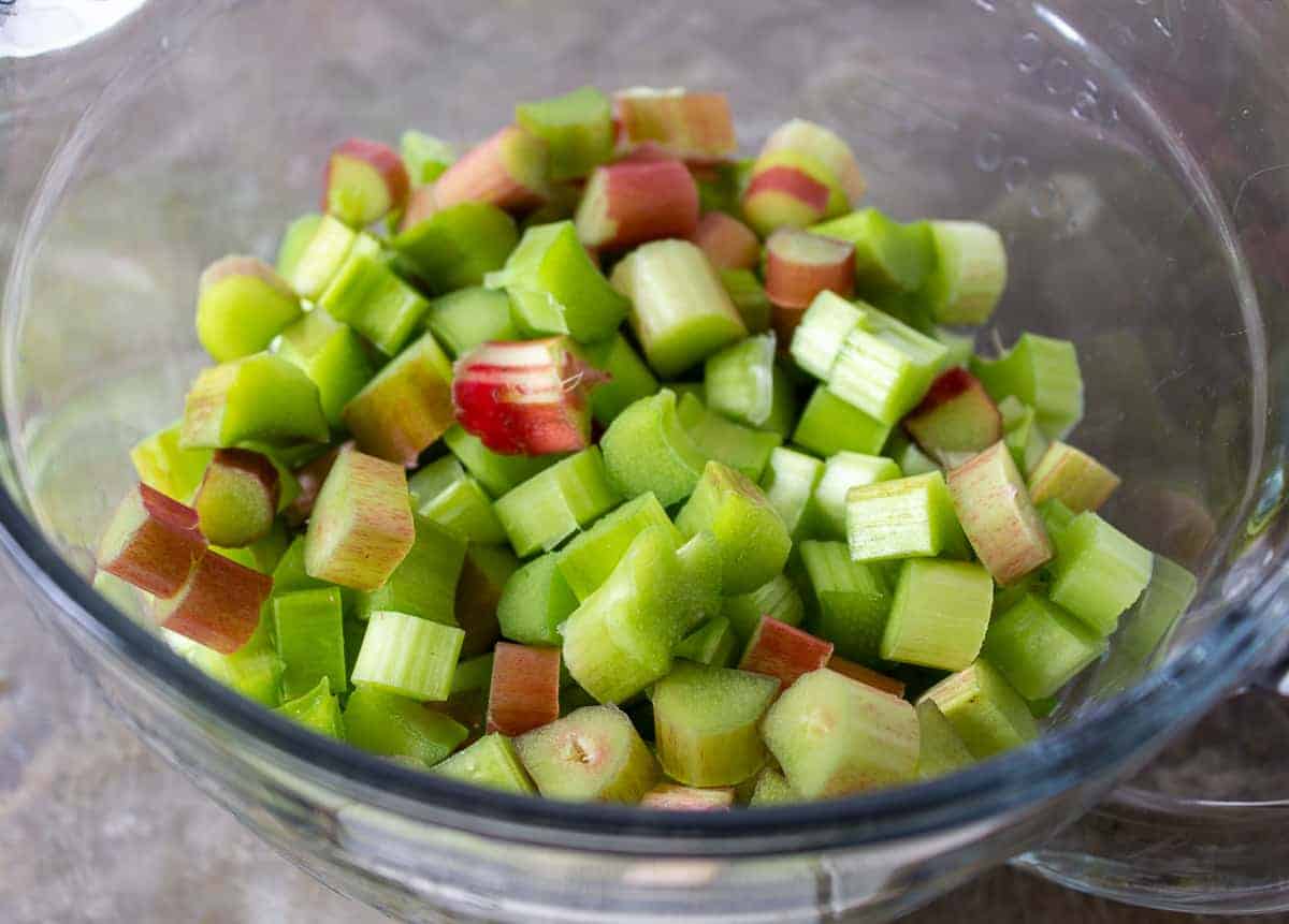 Freshly chopped rhubarb in a glass bowl.