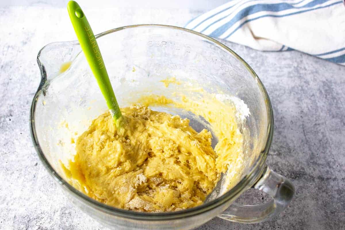 Bread batter in a glass bowl.