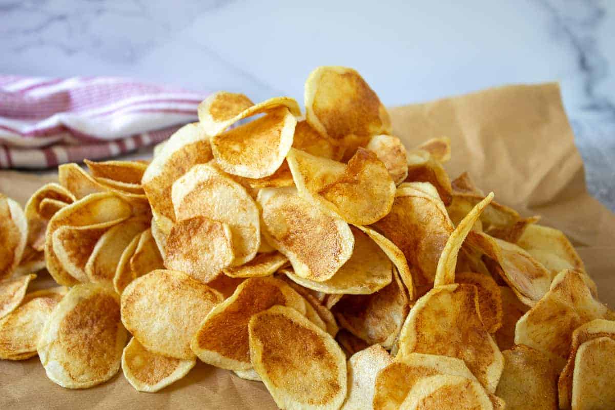 A pile of golden brown potato chips.