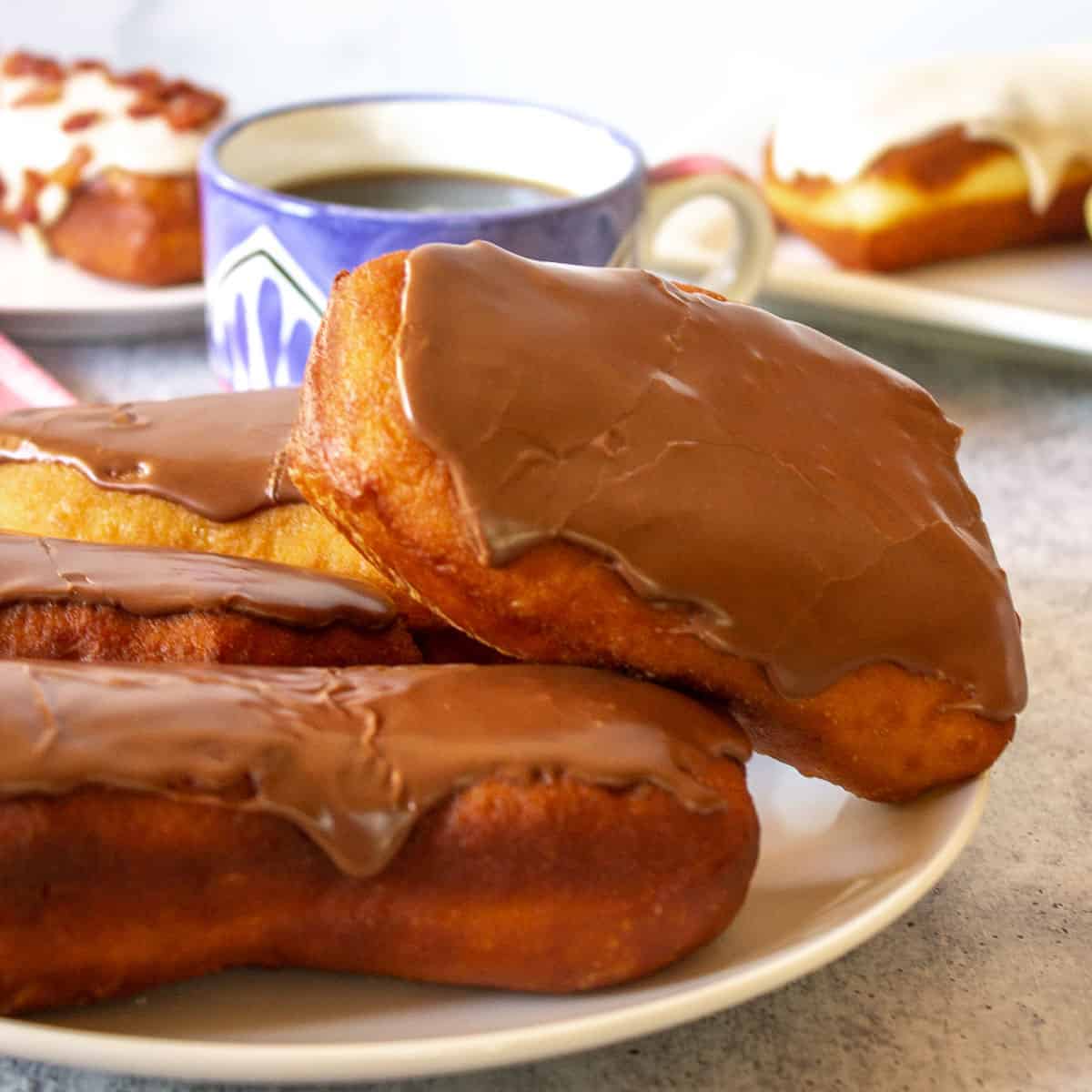 Chocolate covered donut on a plate.