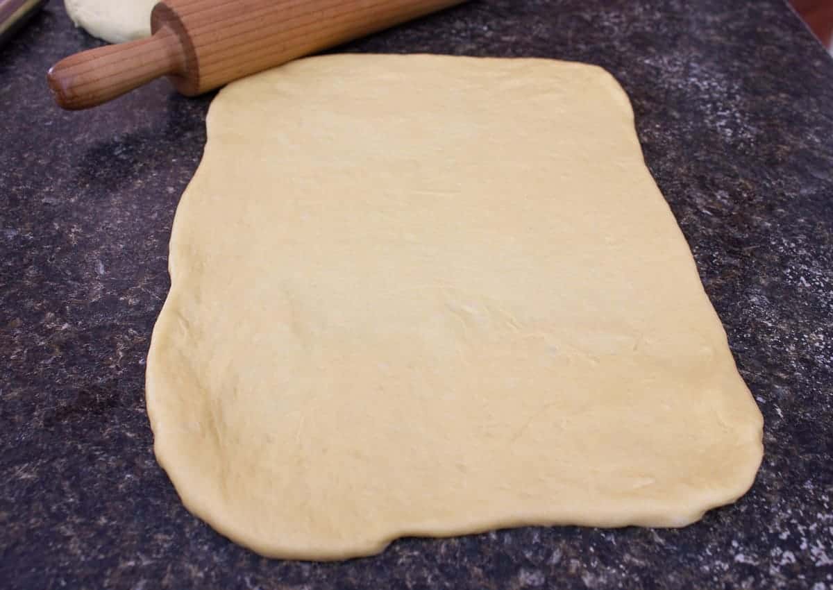 Dough rolled into a rectangular shape.