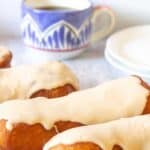 Maple bars with frosting on a white platter.