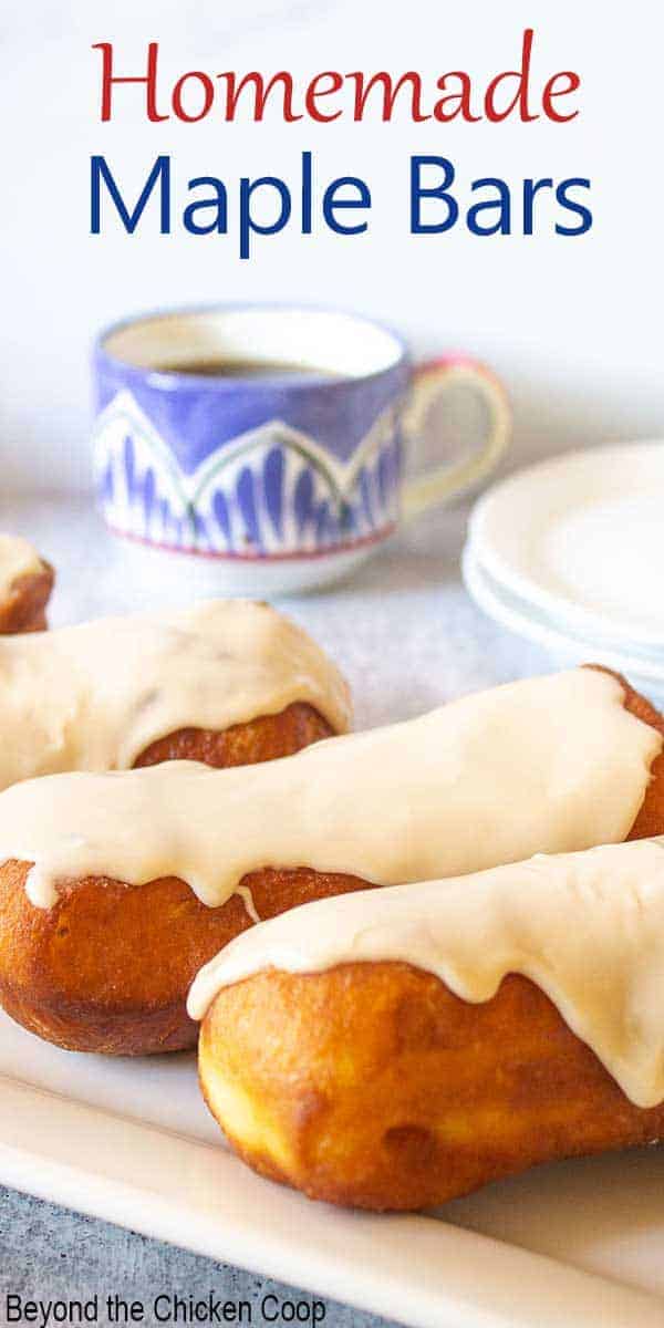 Maple bars with frosting on a white platter.