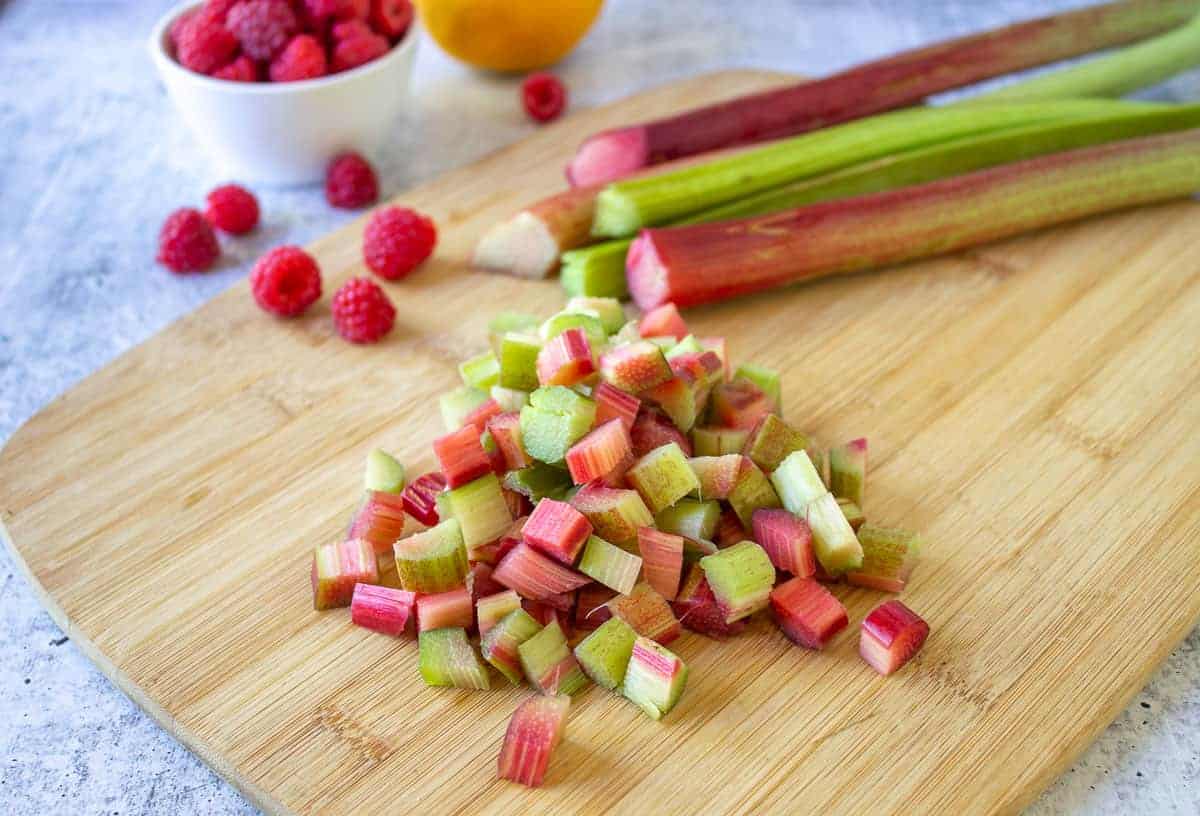 Freshly chopped rhubarb on a cutting board.