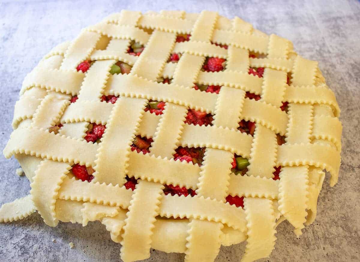 An unbaked pie with a lattice crust. 