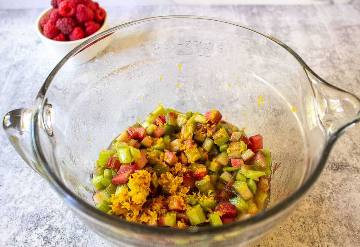 Orange zest with rhubarb in a bowl.