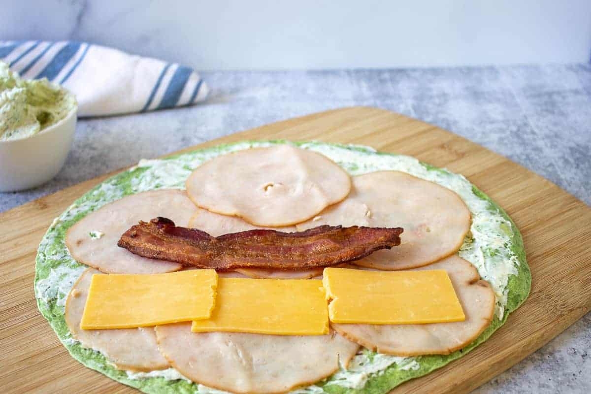 Bacon and cheddar cheese on a wrap.