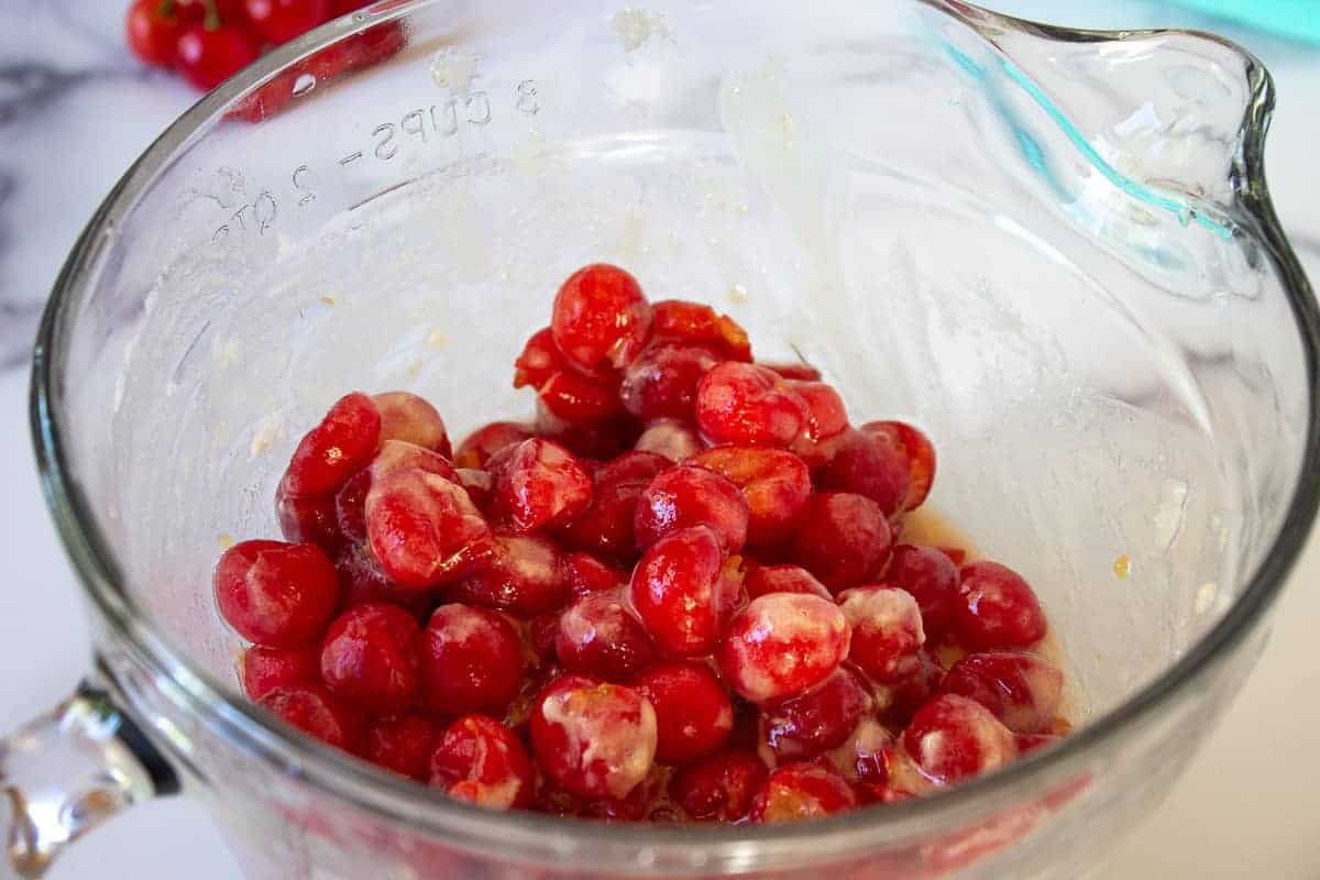 Pie cherries mixed with sugar and flour.