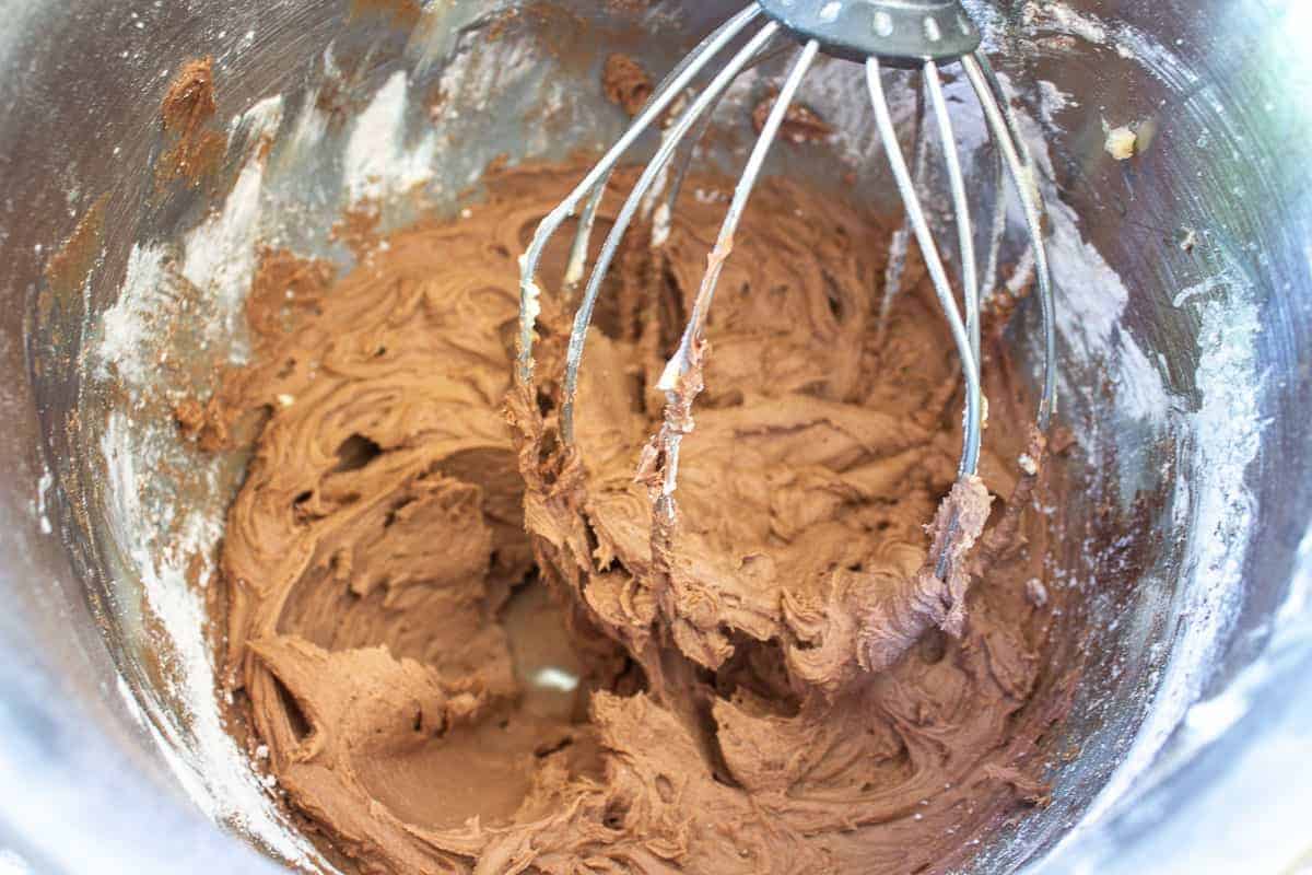 Mixed chocolate frosting in a mixing bowl.