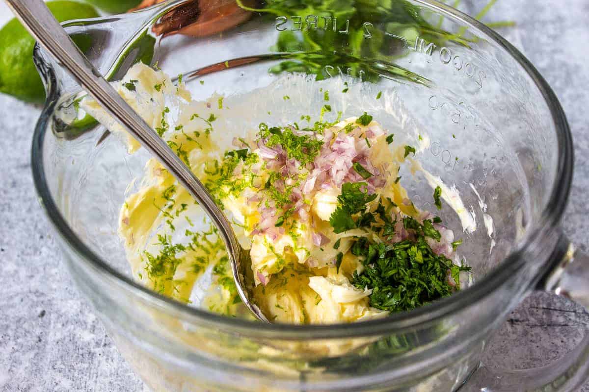 Softened butter with fresh herbs and shallots.