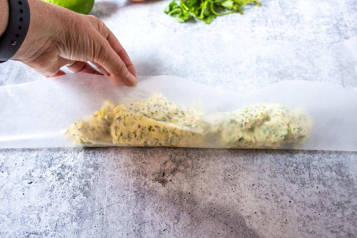 Wax paper forming butter into a log.