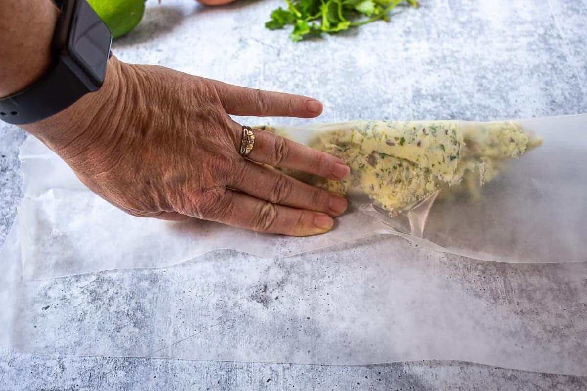 Forming softened butter into a log.