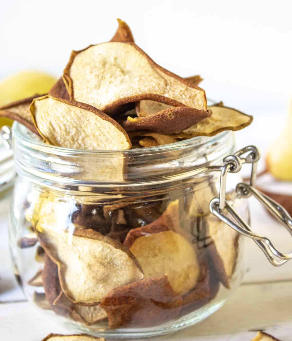 Dried pears in a glass crock.