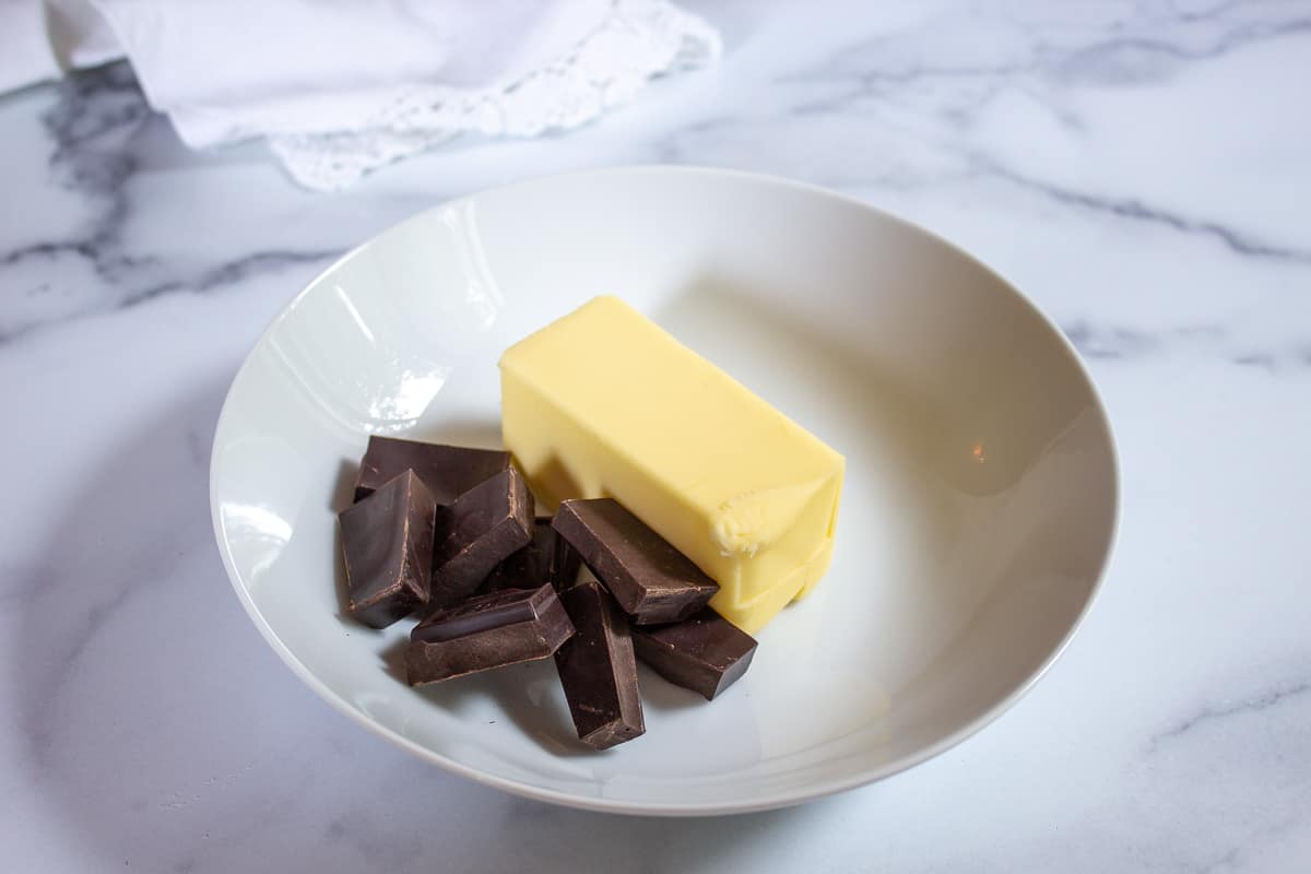 Chunks of chocolate and a stick of butter.