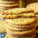 A stack of apple cider snickerdoodles on a baking rack.