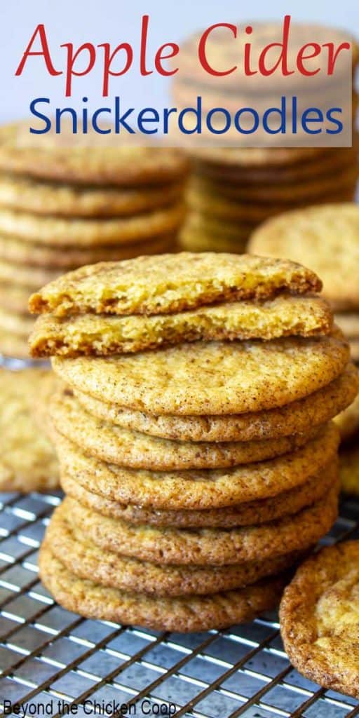 A stack of apple cider snickerdoodles on a baking rack.