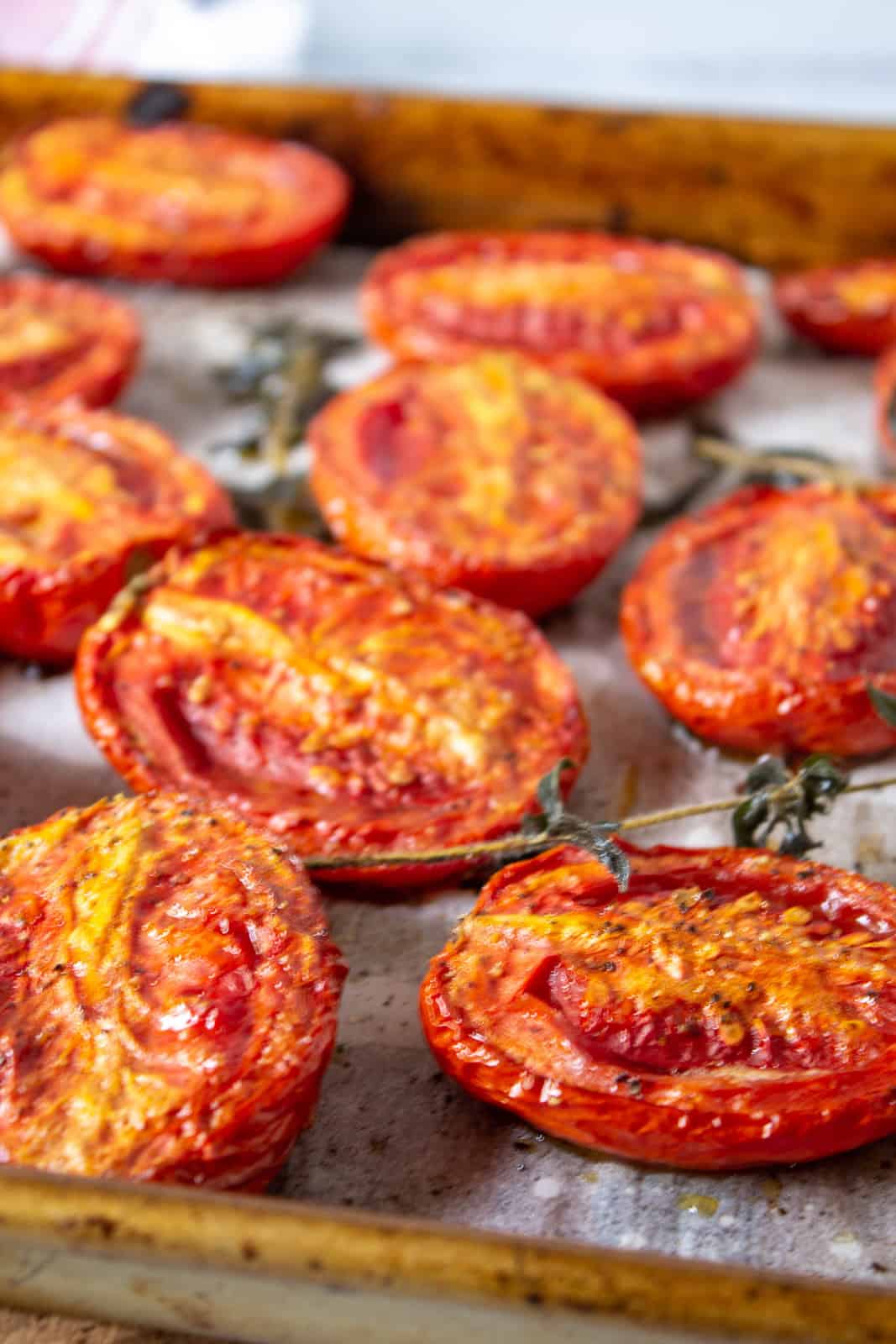 A tray full of oven roasted tomatoes.