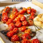 Cherry tomatoes on a baking sheet.