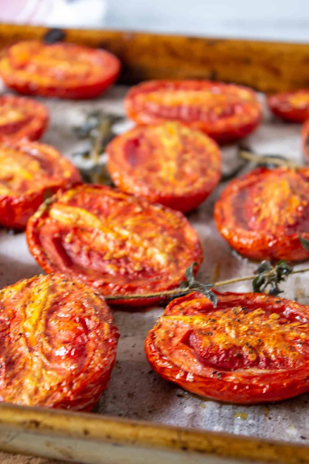 Slow roasted tomatoes on a baking sheet. 